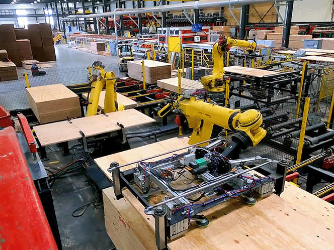 産業用ロボットが工場で働いている写真
