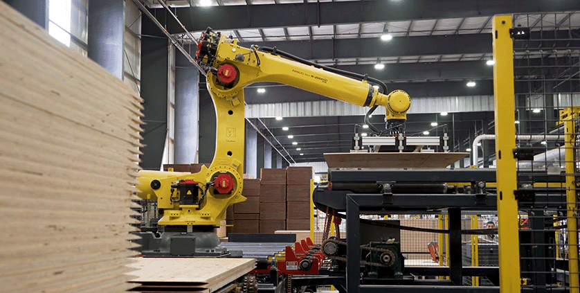ファナックのロボットが板材を運んでいる写真